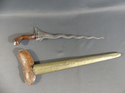 a knife and a hammer sitting on a table