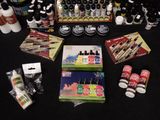 many different types of paint and supplies on the table
