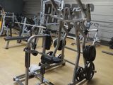 a gym with a lot of machines in the room