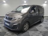 the grey van is parked on a checkered floor in a room