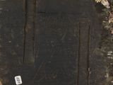 a piece of wood that has a piece of writing on it