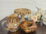 three vases sitting on a table next to each other