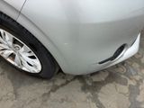 a close up of a car ' s front wheel and tire