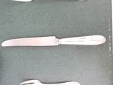 three different types of knives and a knife on a table