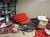 a lot of hoses that are on the floor in the garage