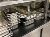 many pans and pans on the counter in the kitchen