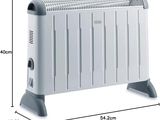 an image of a white electric heater sitting on top of a white table