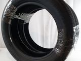 a tire that is sitting on a white surface