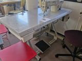 a sewing machine sitting on top of a table in a room