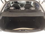 the back of a car with the trunk open and the seats down