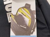 a bag with a cell phone in it sitting on a bag