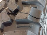 a close up of a tire on a white surface
