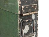 an old green tool box with a handle on a white background