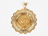 a close up of a gold medal on a white background