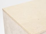 a close up view of a white dresser with a marble top