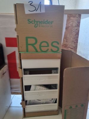 boxes stacked on top of each other on a floor in a room