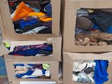 several boxes of clothing are stacked on top of each other