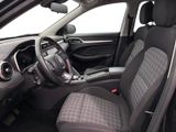 the interior of a car with a steering wheel and a dashboard