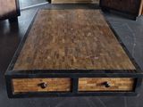 a coffee table with two drawers on it in the middle of a room