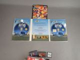 two dvd ' s and a game on the table