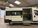 a white van with its doors open in a garage