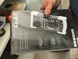 someone is holding a box with a cell phone inside of it