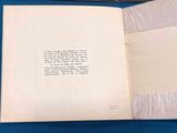 an open book with a picture of a cat on it