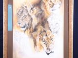 a picture of a painting of three lions on a easel