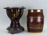 pair of wooden vases with brass rims on stands