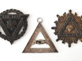 three different metal items that include a triangle, a star, and a triangle