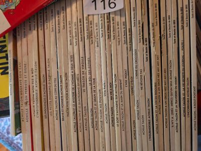 a lot of books that are stacked on top of each other