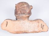 an image of a wooden sculpture of a man ' s head on a piece of wood