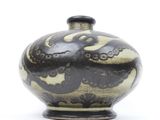 a black and white vase with a design on it
