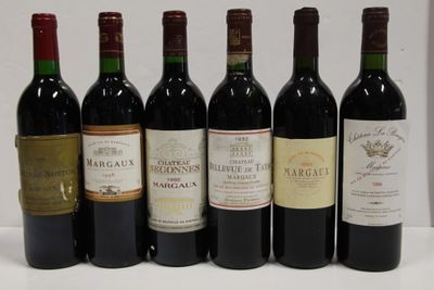 six bottles of wine are lined up in a row on a table