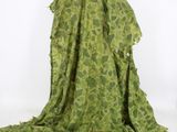 an image of a green dress with a flower pattern on it