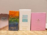 several different types of perfumes are lined up on a table