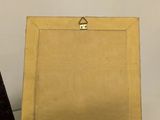 a picture of an easel with a piece of paper on it
