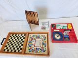 a table with a checker board, a clock, and other items on it