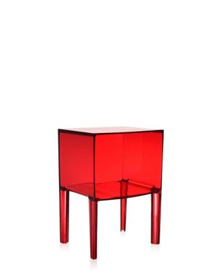 the small red table has two legs and a glass top