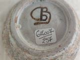 a close up of a bowl with a tag on it