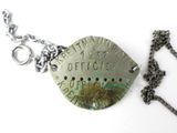 a necklace that has a tag on it that says office depot