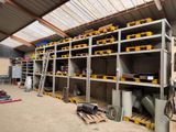 a large room with a lot of shelvings in it
