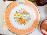 a plate with flowers on it sitting on a table