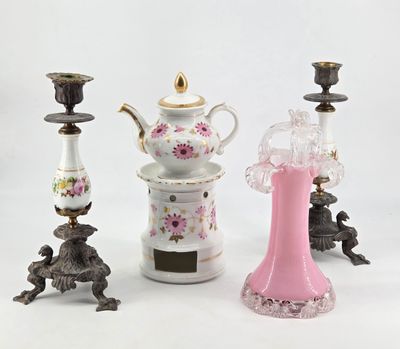 three different vases and a teapot on a white background