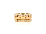a close up of a gold and diamond ring on a white background