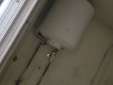 an image of a bathroom with a toilet and a window