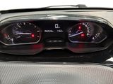 a close up of a car dashboard with gauges on