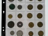 a lot of coins that are in a clear box