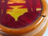 a picture of a wooden box with a painting on it