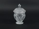 an image of a clear glass jar with a lid on a black background